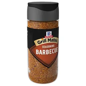McCormick Grill Mates Barbecue Seasoning bottle alongside grilled chicken and burgers