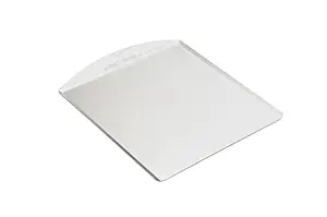 Uncoated aluminum Nordic Ware cookie sheet with cookies cooling