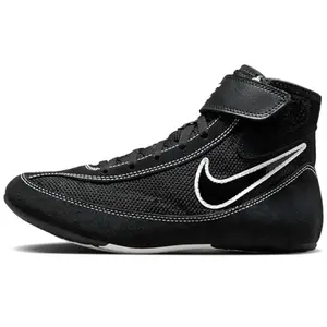 Nike Youth Speedsweep VII wrestling shoes in black with white swoosh on a mat