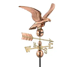 Good Directions polished copper eagle weathervane on a large barn