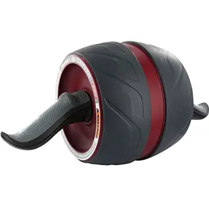 Perfect Fitness Ab Carver Pro roller with built-in spring resistance and ergonomic handles on a gym floor