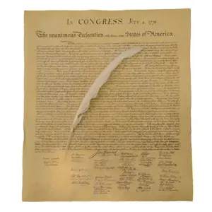 US Declaration of Independence replica document with quill pen on an antique desk
