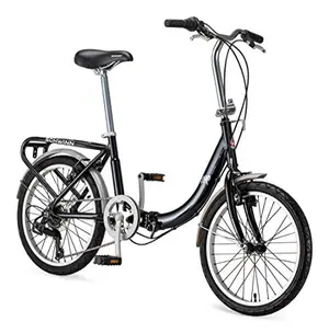 Schwinn Loop folding bike folded next to a desk