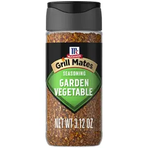 McCormick Grill Mates Garden Vegetable Seasoning bottle on a picnic table