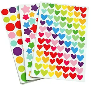 Sheets of dot, heart, and star stickers in assorted colors on a desk