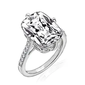 Oversized emerald cut cubic zirconia ring with platinum plated band and accent stones