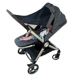 IntiMom stroller sun shade providing full UV protection on a baby stroller