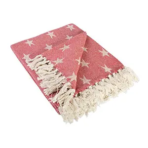 DII stars and stripes cotton throw blanket with decorative red tassels on a couch