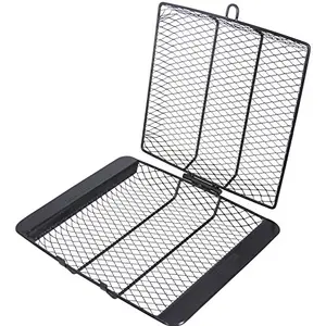 Round stainless steel grill basket with locking lid on a countertop