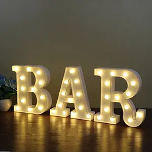 White illuminated BAR marquee sign on wall