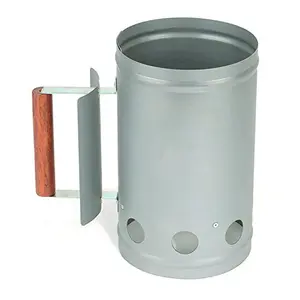 Rocky Mountain Goods charcoal chimney with wooden handle and heat shield on a deck