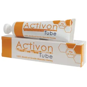 Activon medical grade manuka honey gel tube with honey being squeezed onto a wound dressing