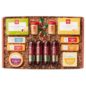 Hickory Farms extra large meat and cheese gift basket displayed on a rustic wooden table with crackers and wine