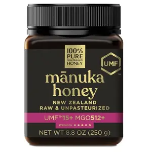 100% Pure New Zealand Honey UMF 15+ jar with a spoon of honey being stirred into hot lemon water