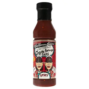 Torchbearer Sauces Chipotle BBQ Sauce 12oz bottle with spicy wings and peppers