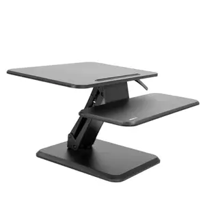 Mount-It 25-inch compact desk converter with laptop and phone slot in a small office
