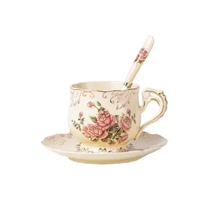 Single pink rose teacup with saucer and spoon, featuring hollow handle and gold trim