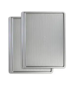 Stack of two USA Pan nonstick cookie sheets