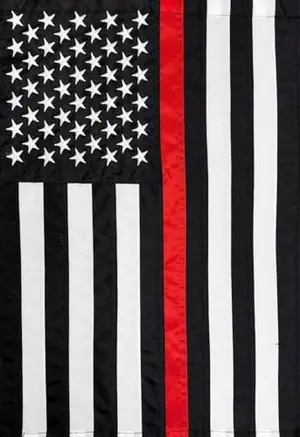 Briarwood Lane Thin Red Line Embroidered Garden Flag displayed in a garden