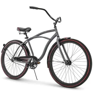 Matte gray Huffy Fairmont cruiser bike with fenders on a beach boardwalk