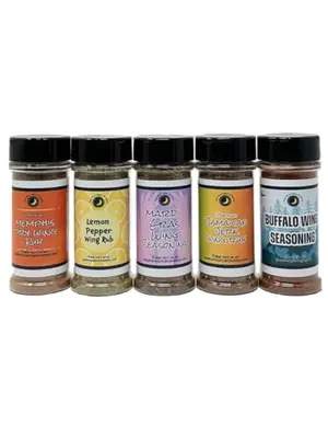 Chicken Wing Seasoning Variety 5-Pack shakers on a BBQ table