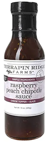 Terrapin Ridge Farms Raspberry Peach Chipotle Sauce bottle with grilled chicken and cracker plate