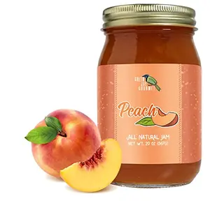 Green Jay Gourmet Peach Jam jar with fresh peaches