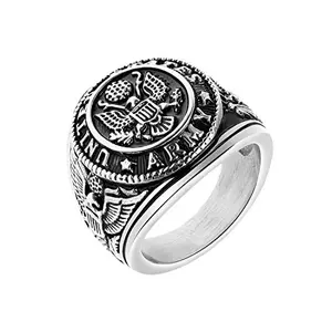 Stainless steel US Army ring with eagle design on a wooden surface