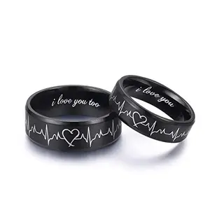 LAVUMO Heartbeat Rings matching set for him and her on a wooden surface