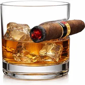 Godinger crystal whiskey glass with indented cigar rest on a dark backdrop