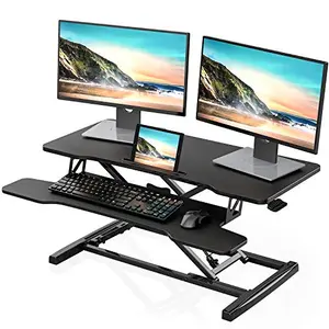 FITUEYES 36-inch sit-stand desk converter with dual monitors on a spacious black surface