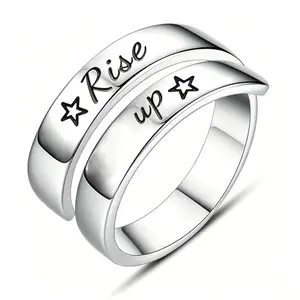 Spiral wrap twist ring with Rise up engraving and star symbols