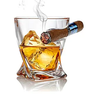 Bezrat whiskey glass with side-mounted cigar holder on a wooden table