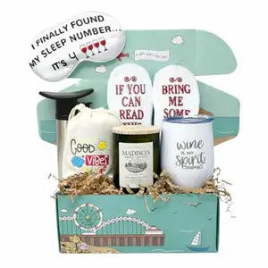Funny wine lover gift basket with tumbler, socks, candle, and accessories
