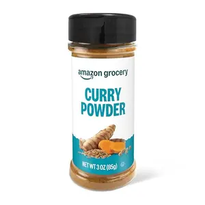Amazon Grocery Curry Powder 3 oz bottle on a wooden spoon