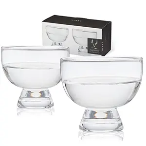 Two crystal mezcal glasses with heavy bases on a bar cart