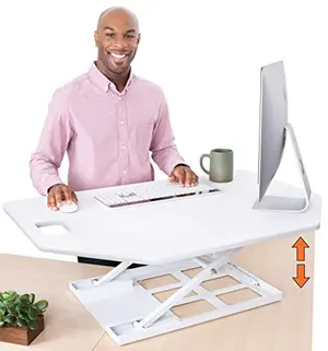 Stand Steady corner desk converter with angled edges in white on an L-shaped desk