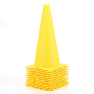 Fragraim tall yellow traffic training cones lined up on grass