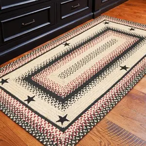 Homespice braided jute rug in Gloucester pattern with black, brown and red tones
