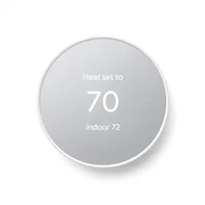 Google Nest Thermostat in Snow color mounted on a wall