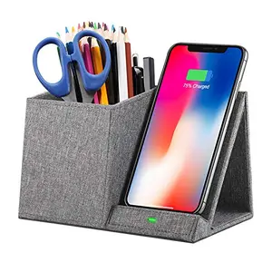 COSOOS desk organizer with built-in wireless charger holding pens and charging iPhone