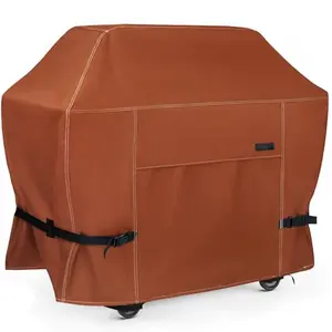 NettyPro brown grill cover with buckle straps protecting a gas grill on a patio
