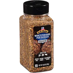 McCormick Pub Burger seasoning jar with a thick, juicy burger on a wooden board