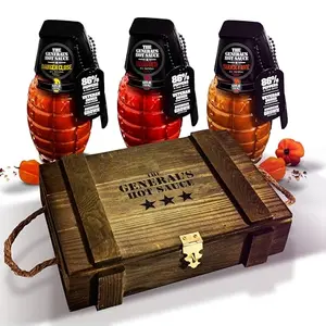 The General's Hot Sauce ammo crate gift set with three grenade-shaped bottles and dog tags
