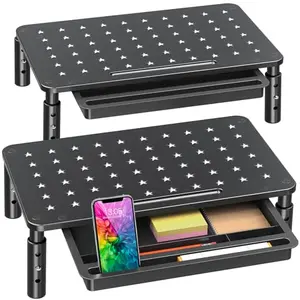 Two black metal monitor risers with star mesh pattern and storage drawer