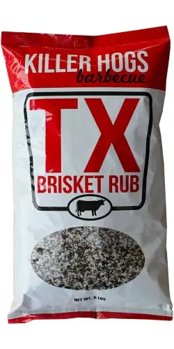 Killer Hogs TX Brisket Rub bottle on a rustic wood surface with brisket in background