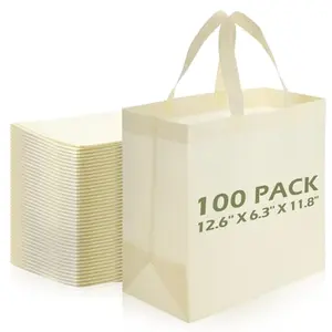 Stack of beige blank non-woven tote bags for trade show giveaways