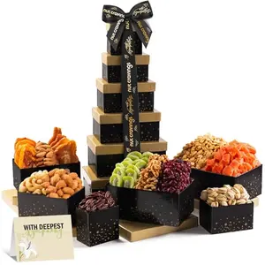 Nut Cravings sympathy gift tower with dried fruits and nuts in elegant black and gold packaging