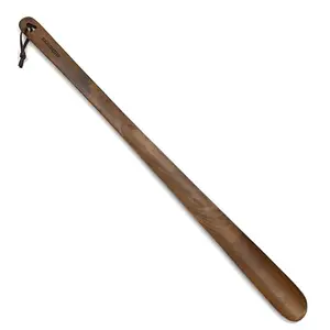 Brosisincorp long wooden shoe horn with leather strap hanging on hook