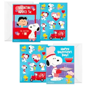 Peanuts Snoopy Valentine's Day cards with stickers and envelopes spread out on a table